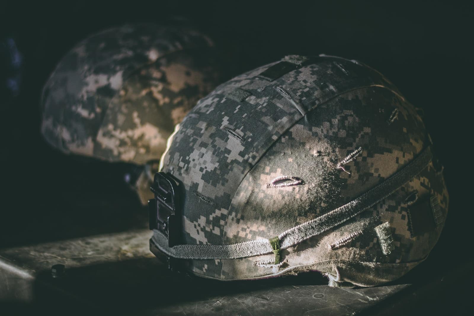 Remembering Our Veterans: Meaningful Veterans Day Quotes and Unique Gift Ideas - veterans day quotes | CubeBik Blog gray and brown camouflage nutshell helmet on table
